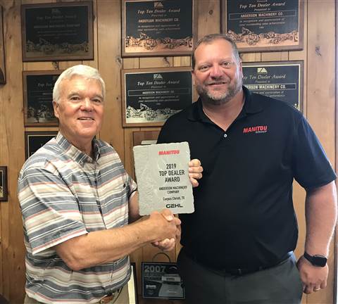 Manitou Group Regional Sales Manager Chris Shoots (right) presents Jim Anderson, owner of Anderson Machinery, with award